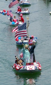 A boater poses as the Statue of Liberty during Oceanside Yacht Club’s annual parade that can be seen from the grass lawns along the harbor.Photo courtesy of Oceanside Yacht Club